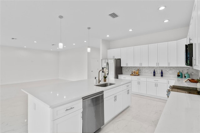 kitchen with visible vents, decorative backsplash, appliances with stainless steel finishes, marble finish floor, and a sink