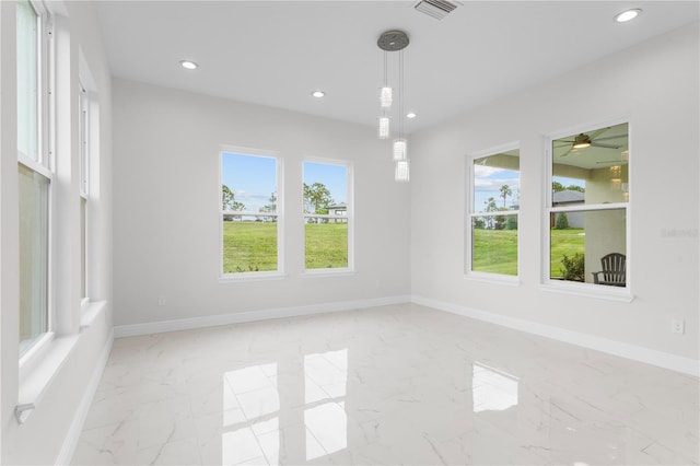 spare room with recessed lighting, visible vents, baseboards, and marble finish floor