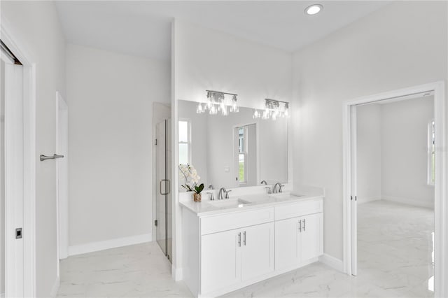 bathroom featuring vanity and a shower with shower door