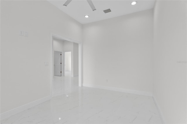 empty room with recessed lighting, visible vents, marble finish floor, and baseboards