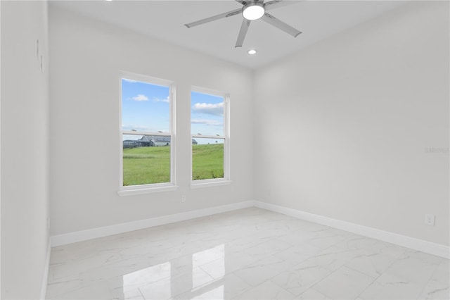 spare room featuring ceiling fan