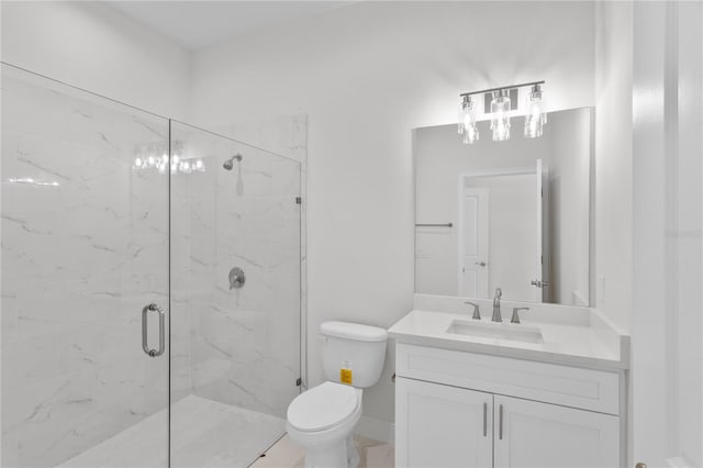 bathroom with vanity, toilet, and an enclosed shower