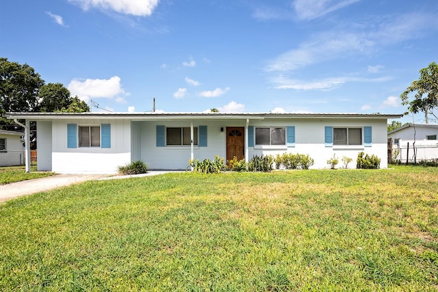 ranch-style house with a front lawn