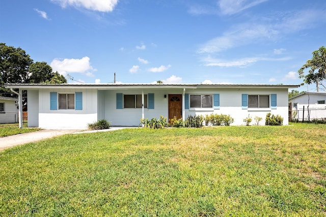 single story home featuring a front yard