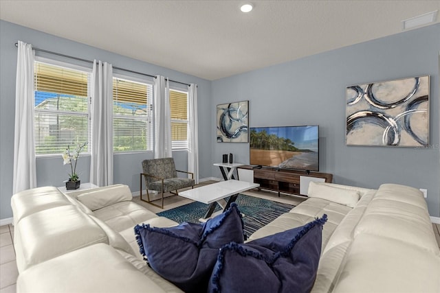 living room with a textured ceiling