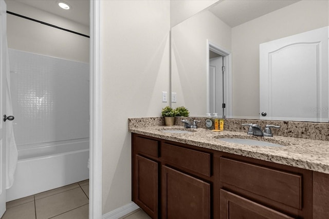 bathroom featuring tile patterned floors, bathtub / shower combination, and vanity