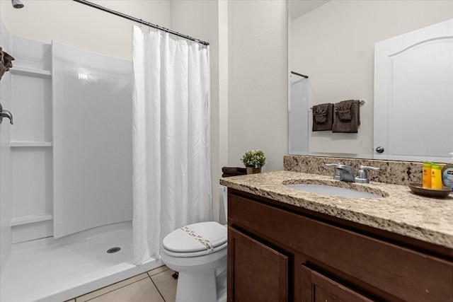 bathroom featuring tile patterned floors, toilet, curtained shower, and vanity