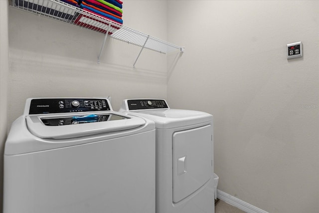 washroom featuring independent washer and dryer