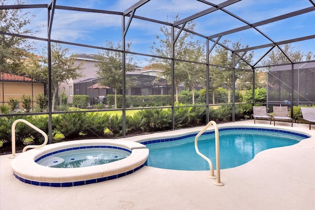 view of pool with an in ground hot tub and glass enclosure