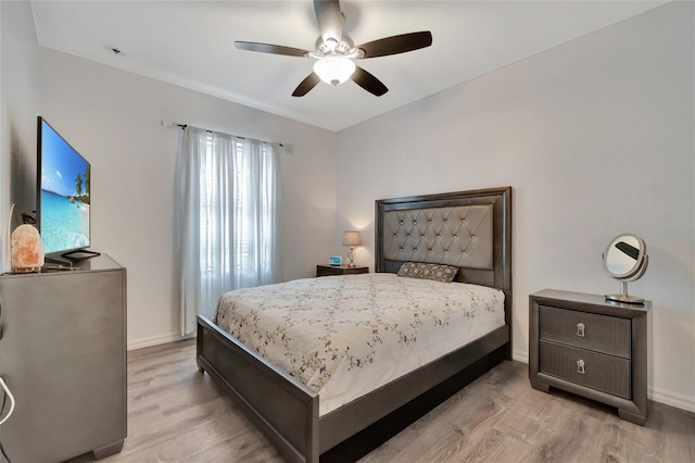 bedroom featuring light hardwood / wood-style flooring and ceiling fan