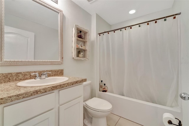 full bathroom with vanity, toilet, tile patterned floors, and shower / bath combo