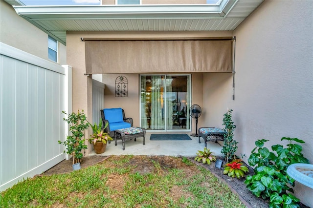 entrance to property featuring a patio area