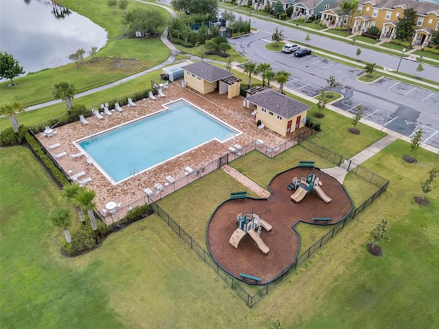 view of swimming pool with a lawn