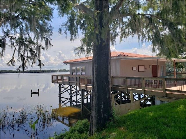 view of dock with a deck with water view