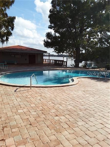 view of swimming pool featuring a patio area