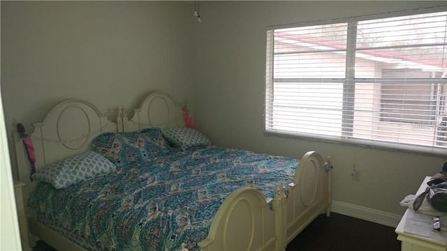 bedroom with multiple windows