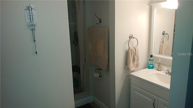 bathroom featuring vanity and walk in shower