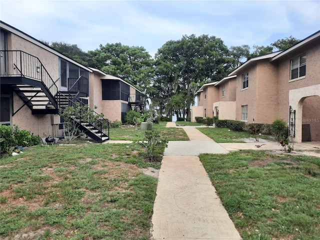 view of home's community featuring a lawn