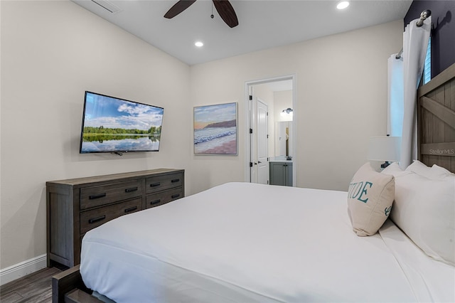 bedroom with wood-type flooring, connected bathroom, and ceiling fan