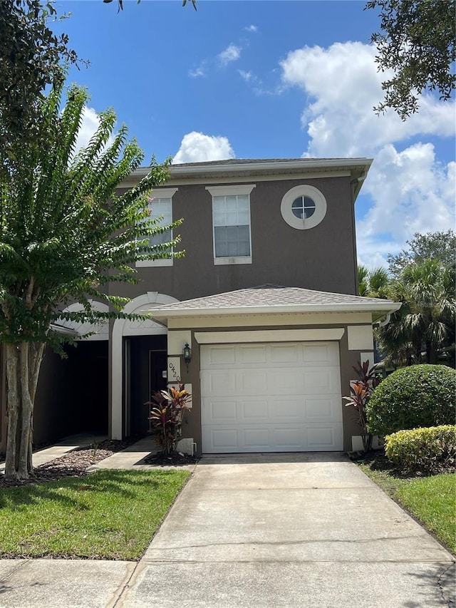 front of property with a garage