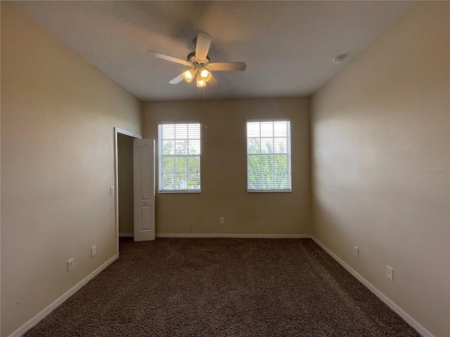 carpeted empty room with ceiling fan