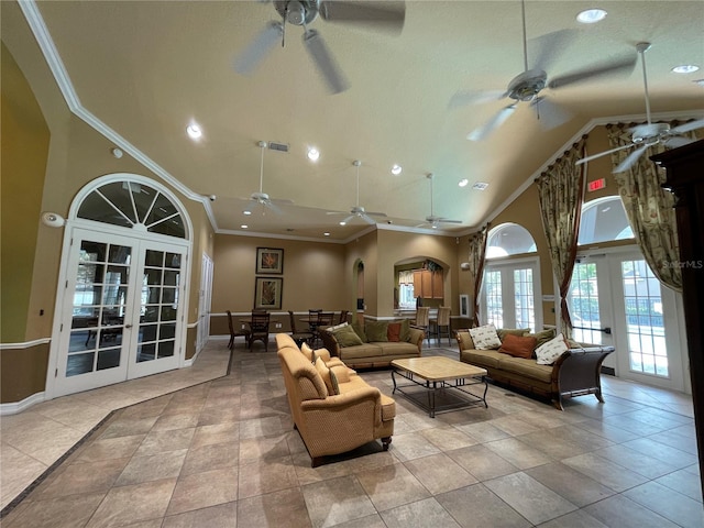 tiled living room featuring french doors, ceiling fan, ornamental molding, and high vaulted ceiling