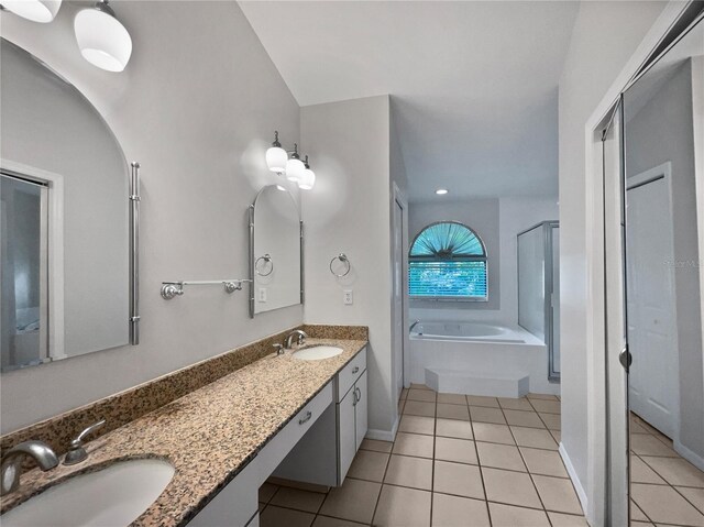 bathroom featuring vanity, separate shower and tub, and tile patterned floors