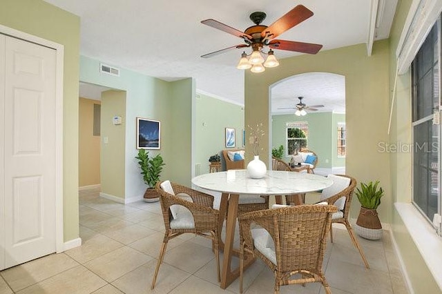 dining area with light tile patterned flooring and ceiling fan