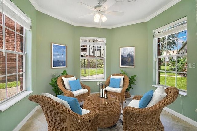 sitting room with crown molding and ceiling fan