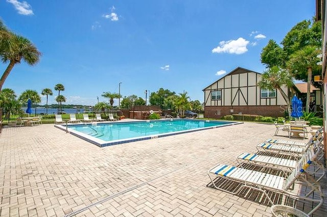 view of swimming pool with a patio area