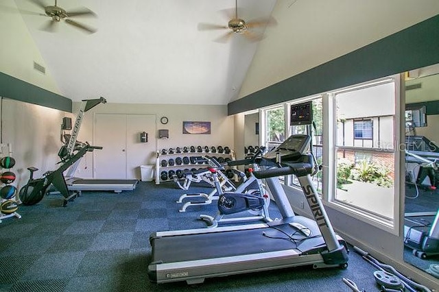 gym with high vaulted ceiling and ceiling fan