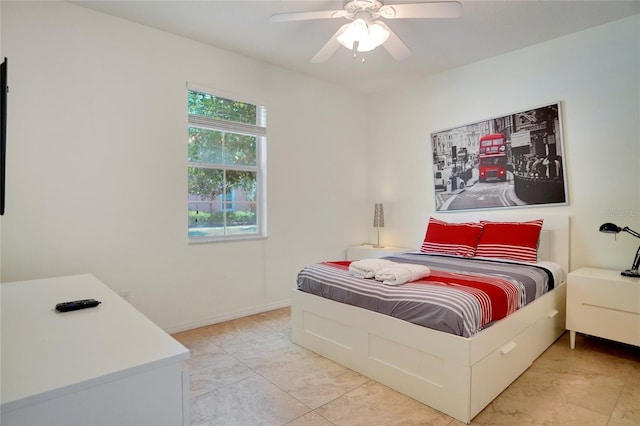 bedroom featuring light tile patterned floors and ceiling fan