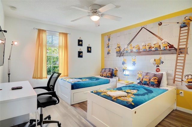 bedroom featuring light hardwood / wood-style floors and ceiling fan