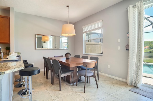 tiled dining area with a wealth of natural light