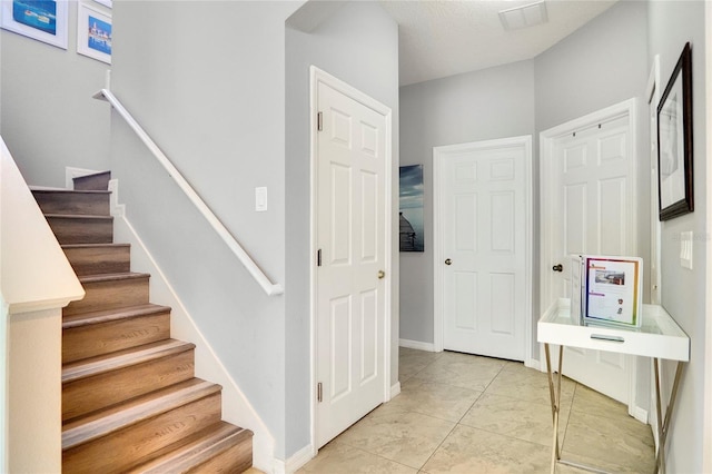 interior space featuring light tile patterned floors