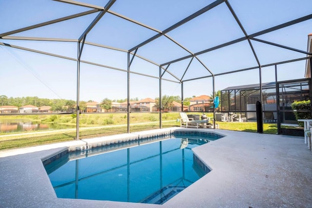 view of pool featuring a lanai, a patio, and a lawn