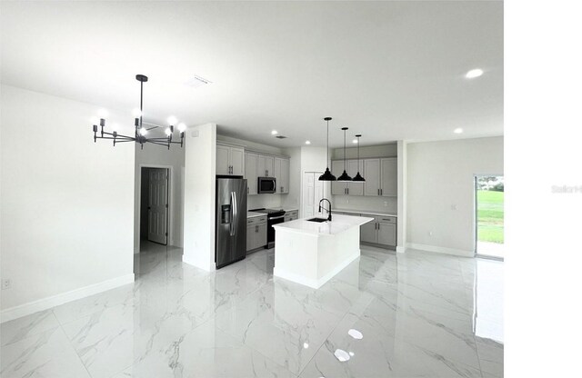 kitchen featuring stainless steel appliances, gray cabinetry, hanging light fixtures, an island with sink, and light tile patterned flooring