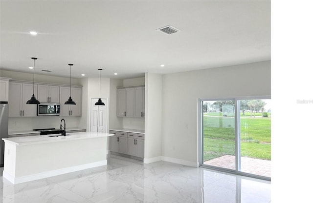 kitchen with visible vents, baseboards, appliances with stainless steel finishes, marble finish floor, and gray cabinetry