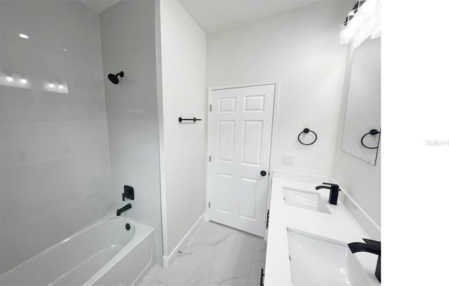 bathroom with  shower combination, marble finish floor, a sink, and baseboards