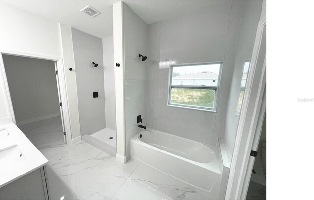 bathroom featuring a stall shower, visible vents, marble finish floor, vanity, and a bath