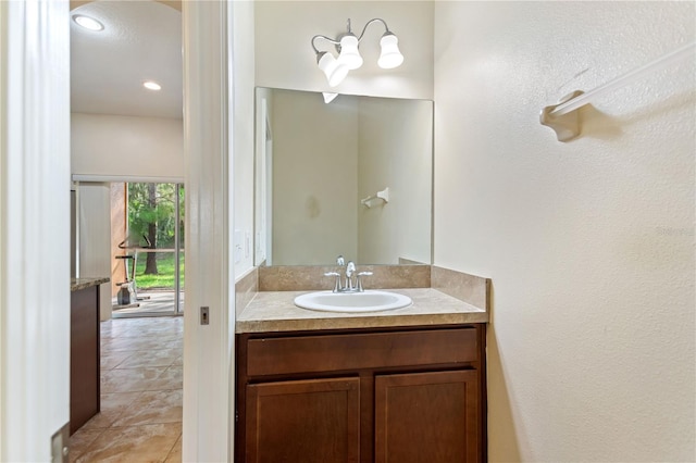 bathroom with vanity and tile patterned floors