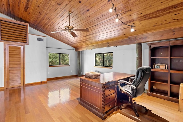 office space with wood finished floors, visible vents, baseboards, vaulted ceiling, and track lighting