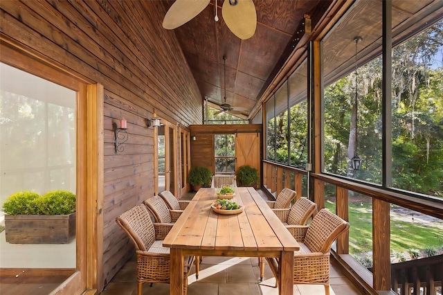 sunroom / solarium featuring lofted ceiling, wooden ceiling, and ceiling fan