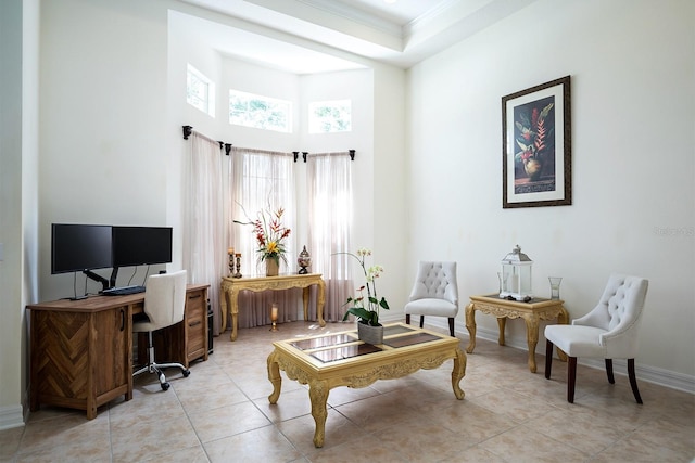 living area with crown molding, a high ceiling, and light tile patterned flooring