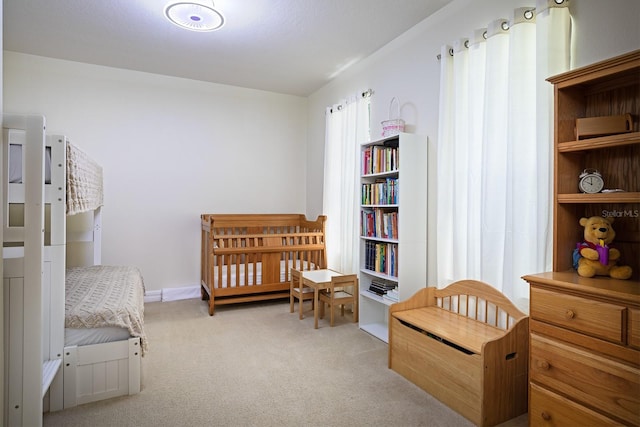 bedroom featuring light colored carpet