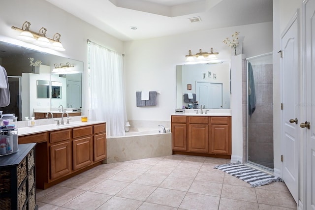 bathroom featuring tile patterned flooring, plus walk in shower, and vanity