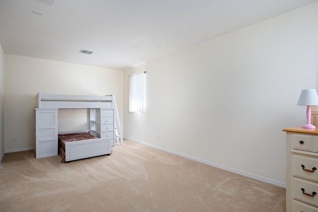 unfurnished bedroom with light carpet