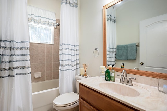 full bathroom featuring shower / tub combo with curtain, vanity, and toilet