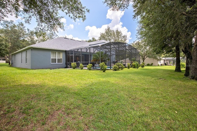 view of yard with glass enclosure