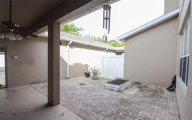 view of patio / terrace featuring ceiling fan